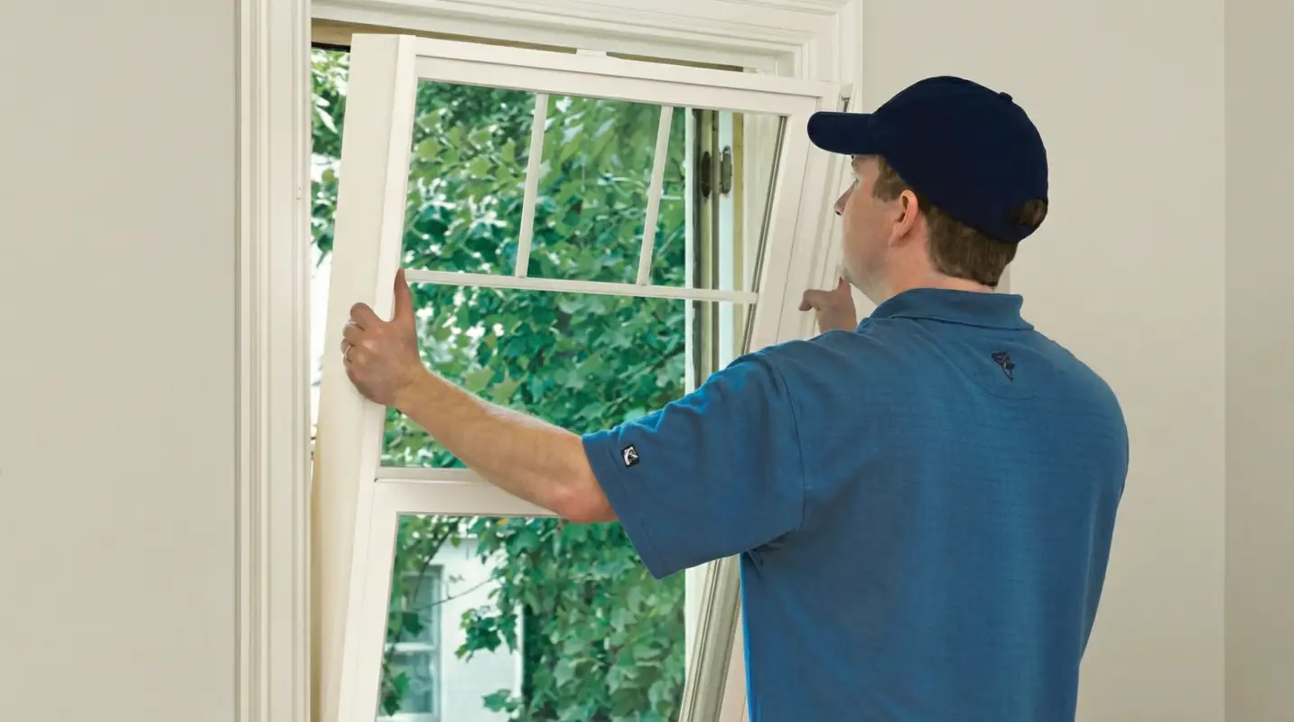 Professional contractors performing a residential window insulation and replacement service in Columbus, OH
